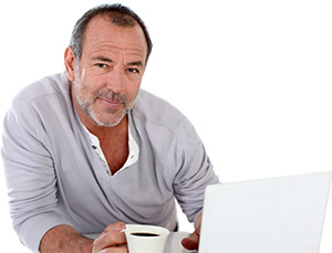 Man drinking coffee with laptop